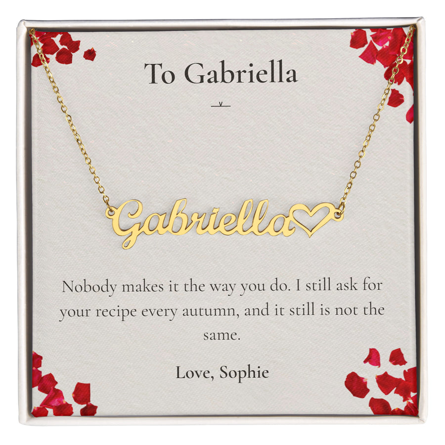 Gold custom name necklace reading Gabriella, on a personalised message card.