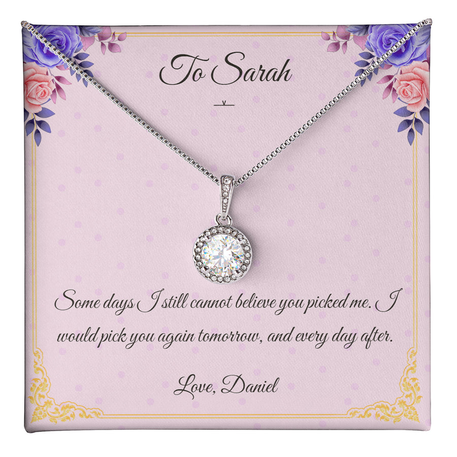 Eternal Aura Necklace lying on a personalised message card addressed to Sarah.